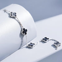 [Globe Jewelers] Armband mit Kleeblattmotiv und geädertem Onyx, Silber